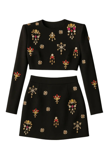 Black skirt set with colorful rhinestones and gems on a white background